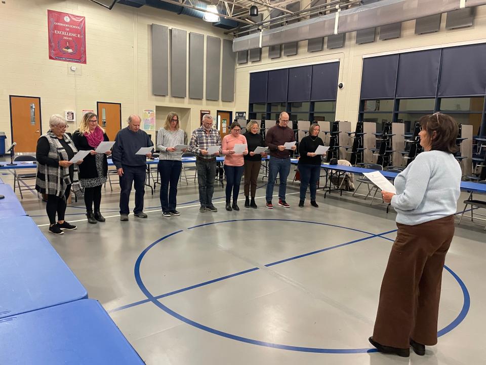 Nine members of the Henry Hudson Regional transitional school board take their oaths of office in the school's cafeteria on Jan. 4, 2024.