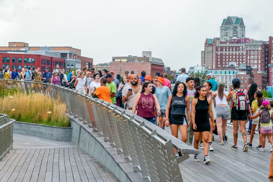 Foot traffic flows over the pedestrian bridge during PVDFest 2023.