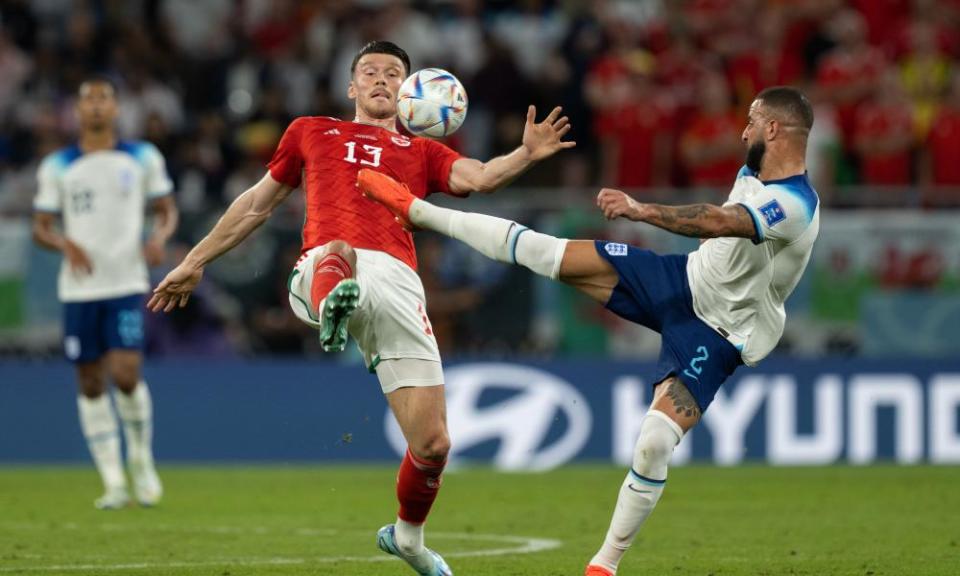 Kyle Walker (right) vies with Kieffer Moore of Wales.