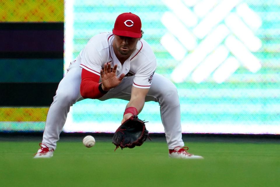 Cincinnati Reds shortstop Kyle Farmer (17) fields a groundball in the fourth inning of a baseball game against the Milwaukee Brewers, Monday, May 9, 2022, at Great American Ball Park in Cincinnati. 