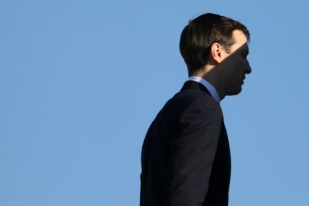 FILE PHOTO: Shadow falls across White House senior advisor Jared Kushner as he boards Air Force One for travel to Kansas City with U.S. President Donald Trump from Joint Base Andrews, Maryland, U.S. December 7, 2018. REUTERS/Jonathan Ernst