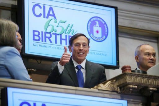 File picture shows Central Intelligence Agency Director David Petraeus (C) preparing to ring the Opening Bell of the New York Stock Exchange as the CIA Commemorates it's 65th anniversary on September 18. The FBI uncovered the affair that led to the resignation of Petraeus while investigating threatening emails sent by his lover to a second woman, US media reported