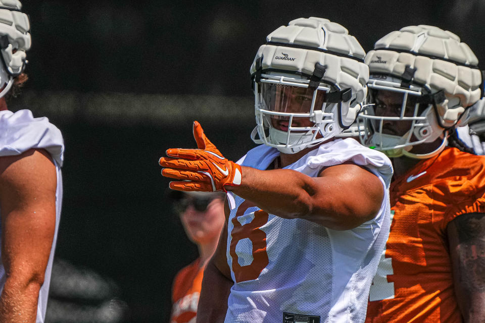 New Texas edge rusher Trey Moore bench-pressed more than 400 pounds earlier this summer, according to offensive tackle Kelvin Banks Jr.