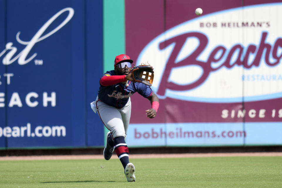 Atlanta Braves center fielder Michael Harris II (23) catches a fly ball hit by Philadelphia Phillies' Nick Castellanos during the first inning of a spring training baseball game Wednesday, Feb. 28, 2024, in Clearwater, Fla. (AP Photo/Charlie Neibergall)