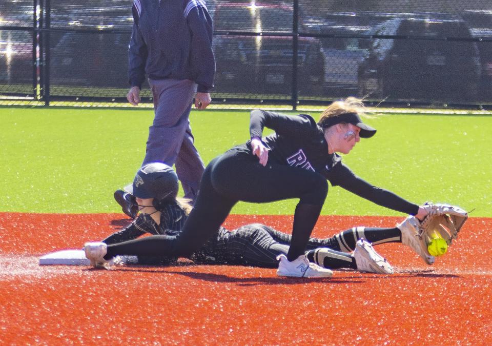 Johnson's Kinlee McGuire slides safely into second base as Vista Ridge shortstop Sayler Bourland  is unable to control the ball during the third inning. Vista Ridge will next play either New Braunfels or San Antonio Lee in the area round.