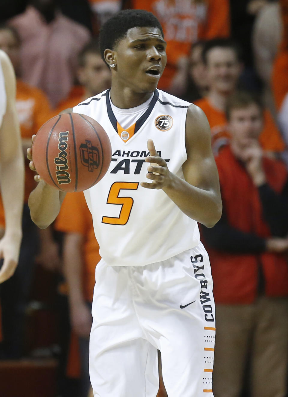 FILE - In this Jan. 9, 2014 file photo, Oklahoma State guard Stevie Clark (5) looks to pass during an NCAA college basketball game against Texas, in Stillwater, Okla. Oklahoma State announced Monday, Feb. 3, that Clark has been kicked off the basketball team. (AP Photo/Sue Ogrocki, File)