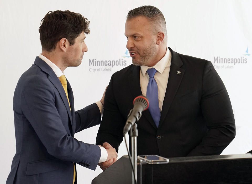 New nominee for Minneapolis Police Department police chief Brian O'Hara, right, currently the deputy mayor of Newark, N.J., is invited to the podium by Minneapolis Mayor Jacob Frey, left, during a press conference introducing O'Hara at the Minneapolis Public Service Building Thursday, Sept. 29, 2022, in Minneapolis. (David Joles/Star Tribune via AP)