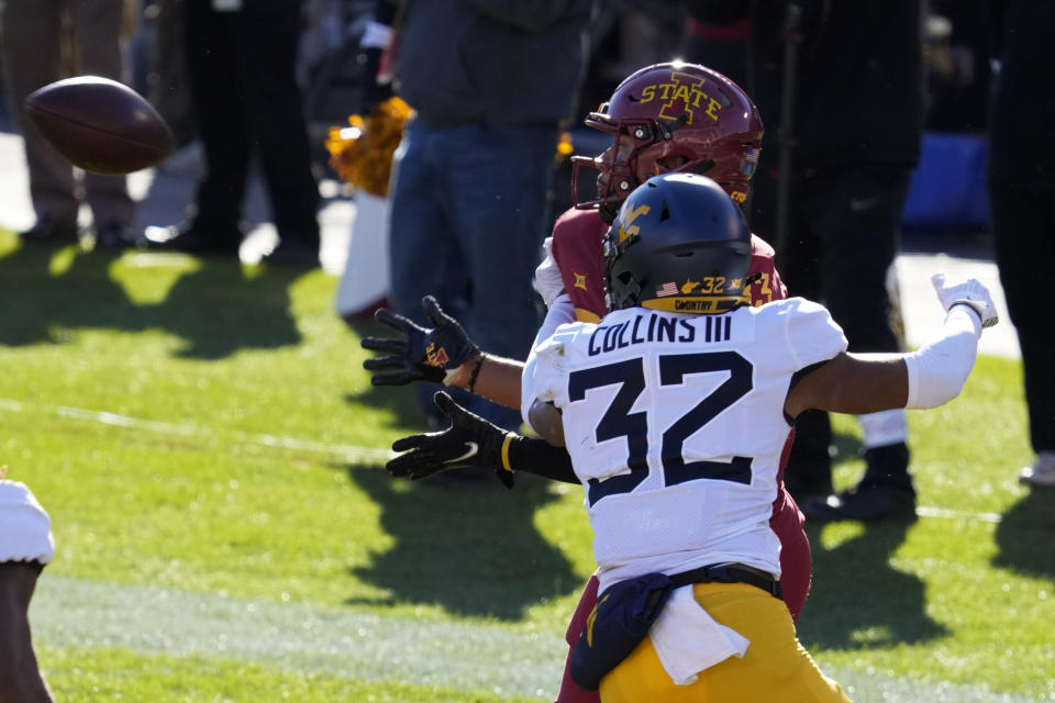 Iowa State tight end DeShawn Hanika catches a 16-yard touchdown pass in front of West Virginia safety Raleigh Collins III (32) during the first half of an NCAA college football game, Saturday, Nov. 5, 2022, in Ames, Iowa. (AP Photo/Charlie Neibergall)