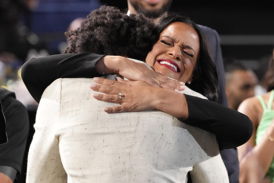 Kobe Bufkin hugs family and friends after being selected 15th overall by the Atlanta Hawks during the NBA basketball draft, Thursday, June 22, 2023, in New York. (AP Photo/John Minchillo)