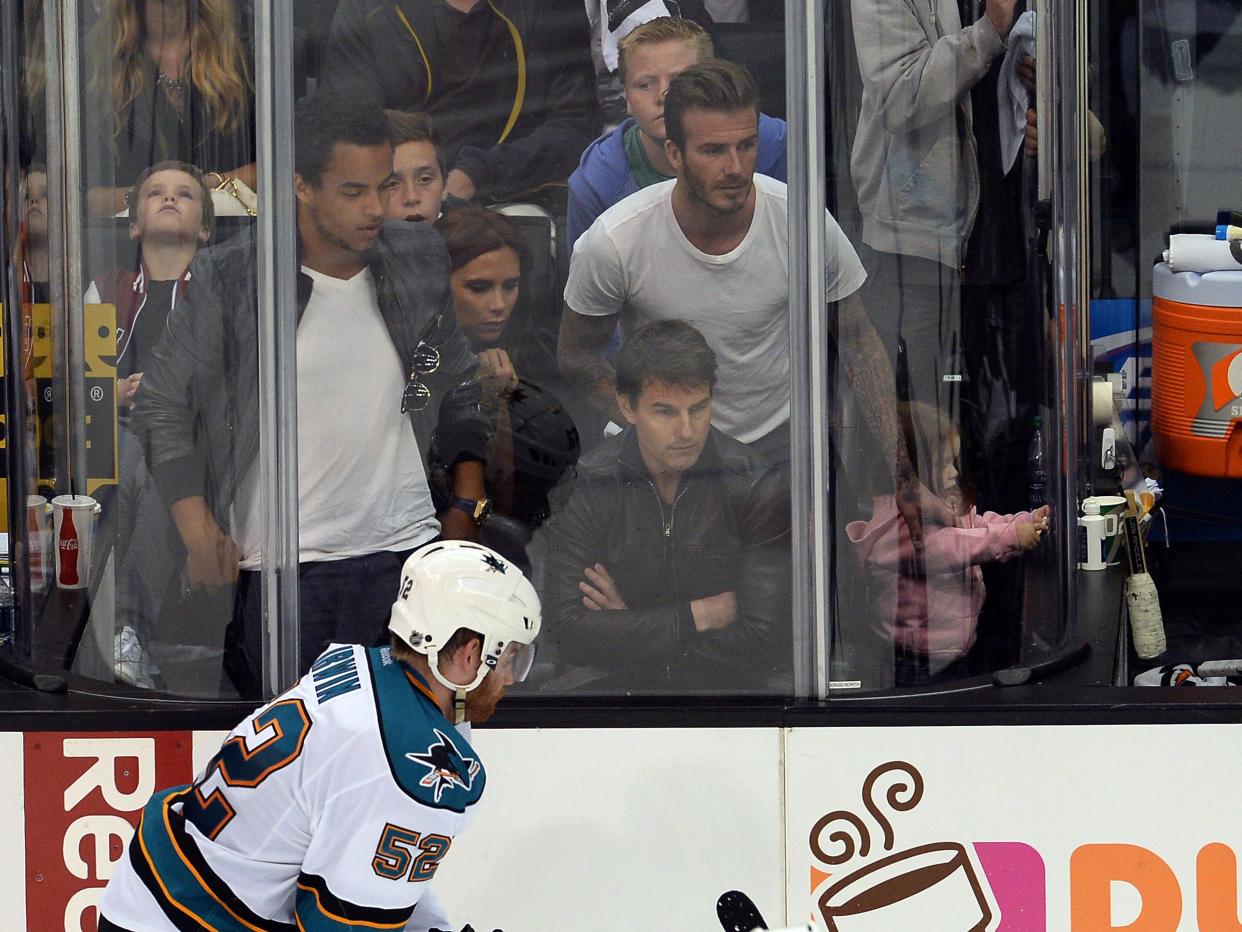 Victoria Beckham (center) and David Beckham (top right) along with Tom Cruise (bottom right) watch game seven of the second round of the 2013 Stanley Cup Playoffs between the Los Angeles Kings and the San Jose Sharks at the Staples Center. Kings won 2-1.