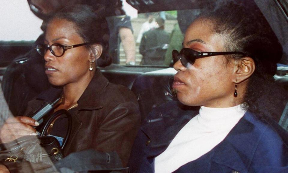 Ilyasah Shabazz, left, and her sister Qubilah Shabazz wait in a car outside family court in Yonkers after attending a court hearing for Qubilah’s son Malcolm, 12, who was arrested in June 1997 in connection with the fire at his grandmother Betty Shabazz’s home.