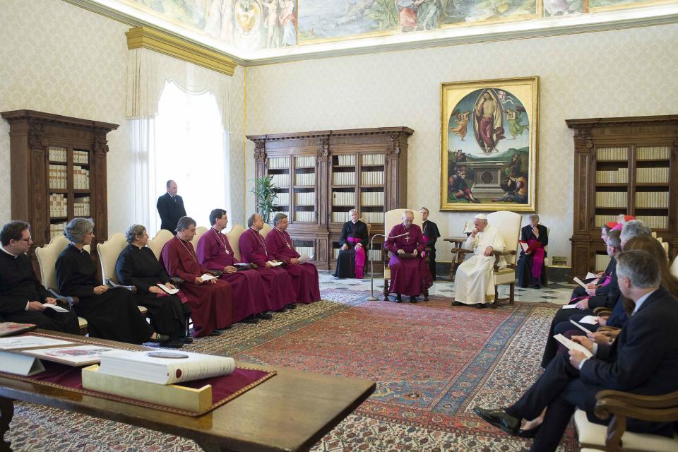 Pope Francis (R) listens to the Archbishop of Canterbury Justin Welby during a private meeting at the Vatican June 16, 2014. REUTERS/Osservatore Romano (VATICAN - Tags: RELIGION) ATTENTION EDITORS - FOR EDITORIAL USE ONLY. NOT FOR SALE FOR MARKETING OR ADVERTISING CAMPAIGNS. THIS IMAGE HAS BEEN SUPPLIED BY A THIRD PARTY. IT IS DISTRIBUTED, EXACTLY AS RECEIVED BY REUTERS, AS A SERVICE TO CLIENTS. NO SALES. NO ARCHIVES