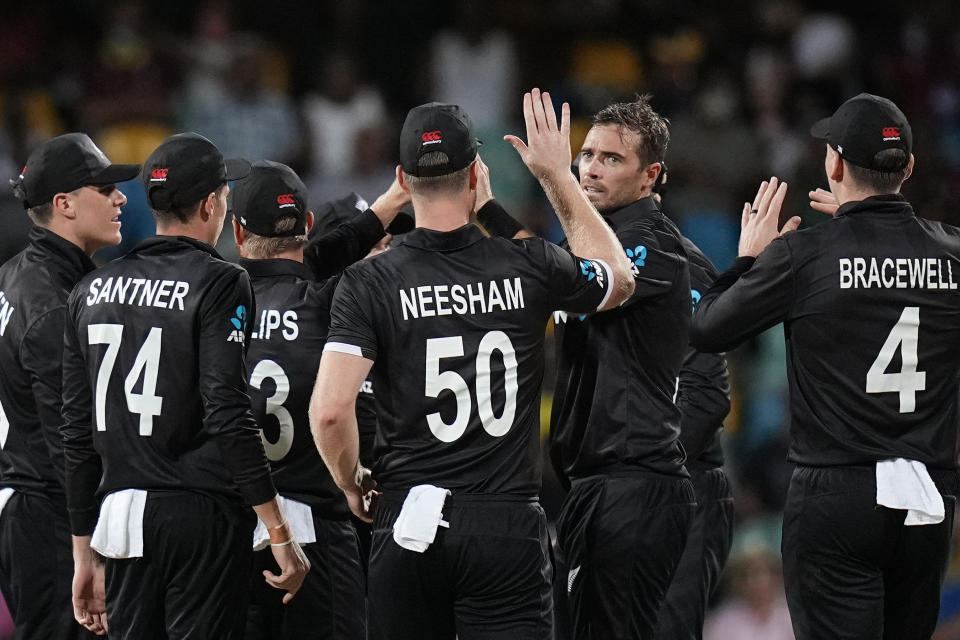 New Zealand's Tim Southee celebrates with teammates after he bowled out West Indies' Shamarh Brooks during the second ODI at Kensington Oval in Bridgetown, Barbados, Friday, Aug. 19, 2022. (AP Photo/Ramon Espinosa)