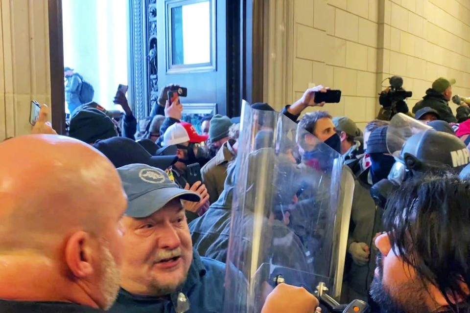 Joseph Fischer, second left, inside the Capitol on Jan. 6, 2021. (U.S. District Court)