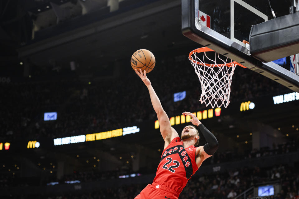 Toronto Raptors guard Malachi Flynn (22) goes up for a lay up during the second half of an NBA basketball game againstg the Detroit Pistons, in Toronto, Sunday, Nov. 19, 2023. (Christopher Katsarov/The Canadian Press via AP)