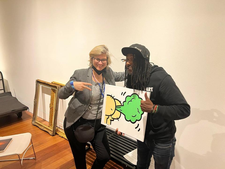 Wilmington artist Greyson Davis with Metropolitan Museum of Art curator Dr. Maia Nuku, accepting his submission to the Cameron's Art Museum's "State of the Art/Art of the State" exhibit.