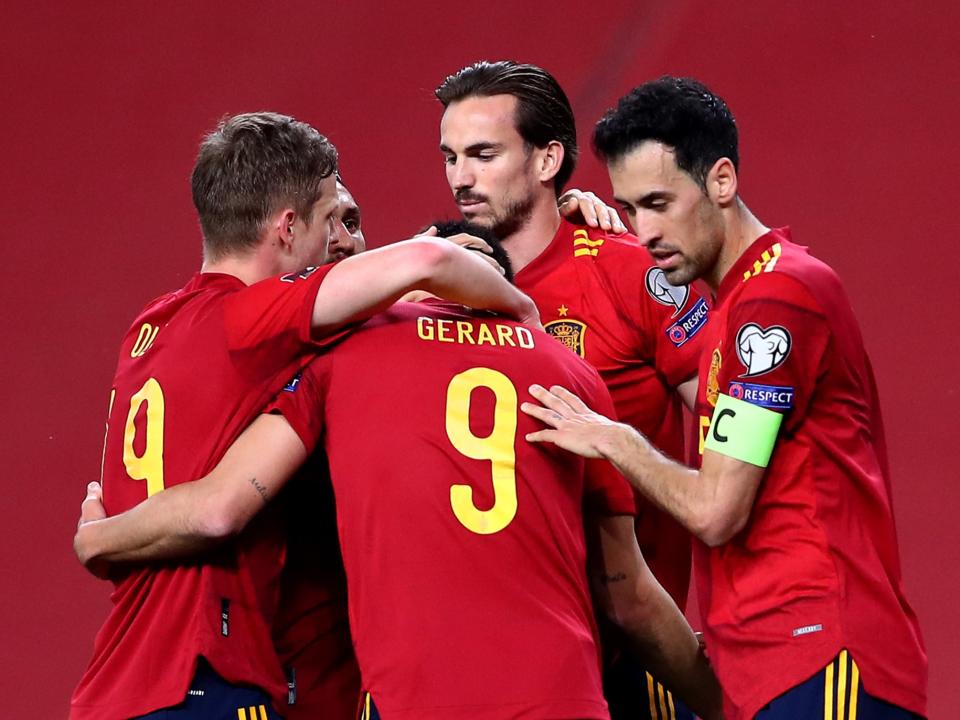 <p>Spain celebrate scoring a goal</p> (PA)