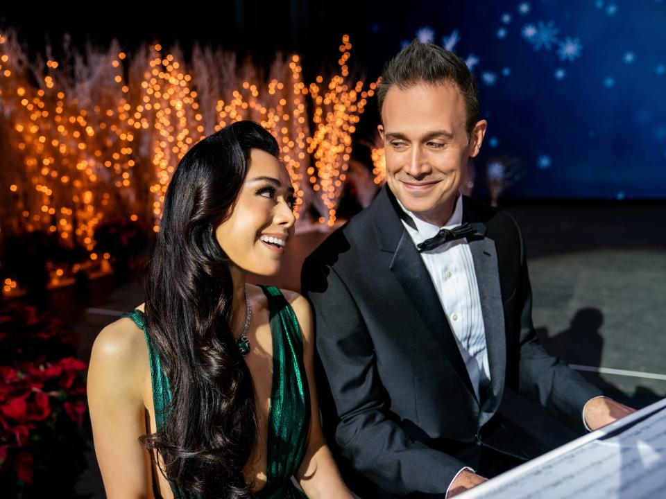 angelina and miguel performing at a piano in christmas with you netflix movie