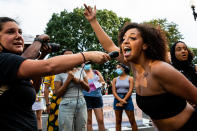 WASHINGTON, DC - AUGUST 27: A protester leads a chant during a protest at Black Lives Matter Plaza on August 27, 2020 in Washington, DC. Protesters gathered on the final night of the Republican National Convention in which both President Donald Trump Vice President Mike Pence accepted the Republican nomination as candidates for a second term as U.S. President. (Photo by Natasha Moustache/Getty Images)