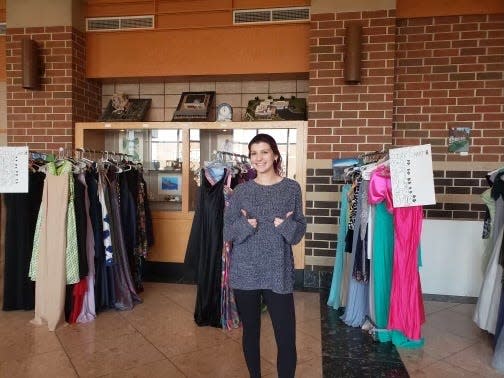 Central Bucks South High School senior Elena DiPrinzio shows some of the prom gowns and other items she collected as part of a Girl Scout project to help other students who may need a gown to go to their prom.