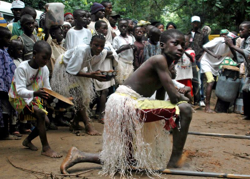 FILE PHOTO: A boy presents a cultural dance at the Osun sacred river during the annual worship festival of a river goddess in Osogbo