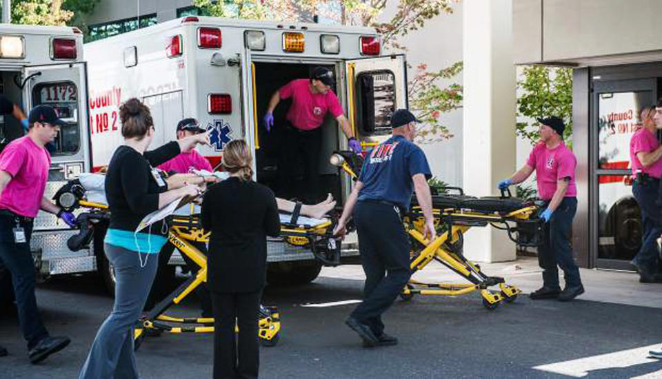 A patient is wheeled into the emergency room at Mercy Medical Center in Roseburg, Ore., following a deadly shooting at Umpqua Community College, in Roseburg, Thursday, Oct. 1, 2015.