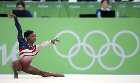 Simone Biles competes on the floor exercise. REUTERS/Damir Sagolj