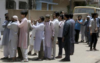 People carry the casket of the victims of Friday's plane crash for funeral prayers in Karachi, Pakistan, Saturday, May 23, 2020. An aviation official says a passenger plane belonging to state-run Pakistan International Airlines carrying passengers and crew has crashed near the southern port city of Karachi. (AP Photo/Fareed Khan)