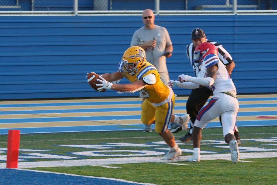 Clyde's Cole Schwochow steps out of bounds as he reaches for the goal line.