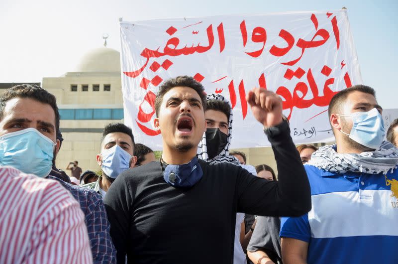 Jordanians demonstrate to express solidarity with the Palestinian people, near the Israeli embassy in Amman