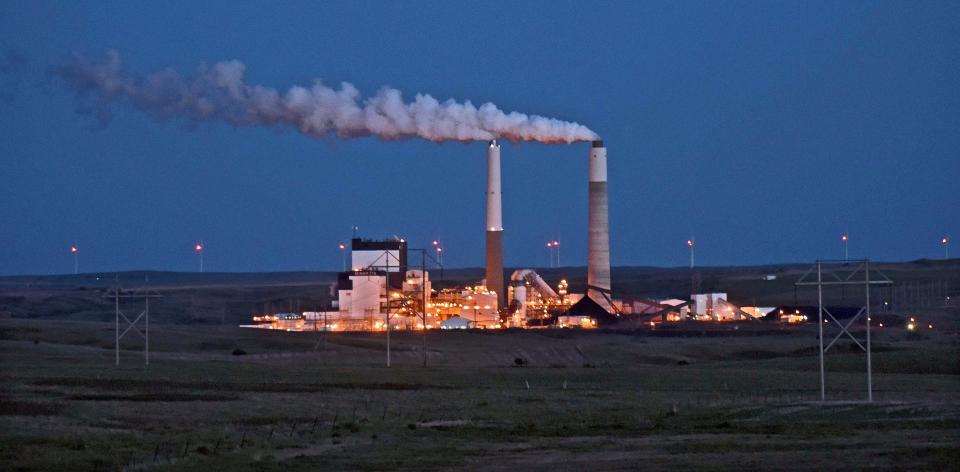 FILE - In this May 25, 2017, file photo, the Milton R. Young Station lignite coal-fired power plant near Center, N.D., glows as dusk blankets the North Dakota prairie landscape. The U.S. Environmental Protection Agency announced Tuesday, Feb. 26, 2019, it will retain the standard for sulfur dioxide pollution established in 2010 under President Barack Obama. Sulfur dioxide comes from burning coal to produce electricity and from other industrial sources. (Tom Stromme/The Bismarck Tribune via AP, File)