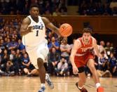 Dec 5, 2018; Durham, NC, USA; Duke Blue Devils forward Zion Williamson (1) collects a loose ball in front of Hartford Hawks guard Jason Dunne (12) during the second half at Cameron Indoor Stadium. Rob Kinnan-USA TODAY Sports