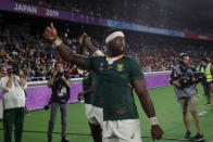 South Africa's Siya Kolisi celebrates after the Rugby World Cup semifinal at International Yokohama Stadium between Wales and South Africa in Yokohama, Japan, Sunday, Oct. 27, 2019. South Africa won 19-16. (AP Photo/Christophe Ena)