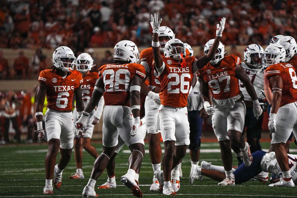 Texas linebacker Ty'Anthony Smith (26) celebrates a defensive stop in the win over UTSA.