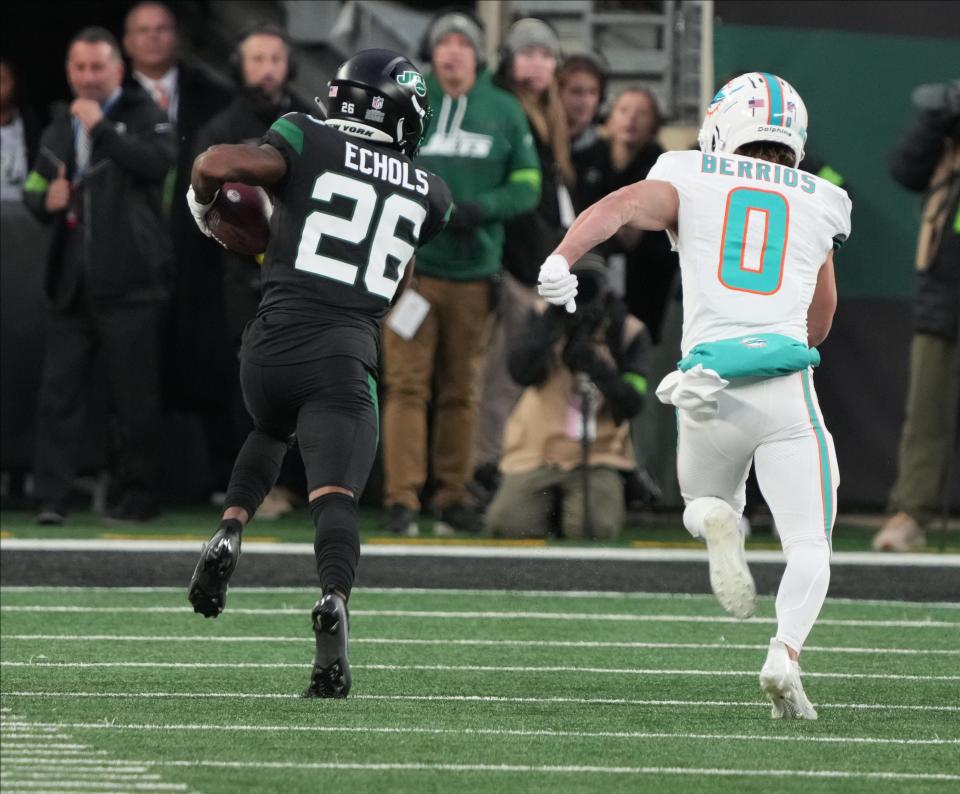 East Rutherford, NJ — November 24, 2023 — Brandin Echols of the Jets returns and interception for a TD in the first half as the Miami Dolphins defeated the NY Jets 34-13 at MetLife Stadium on November 24, 2023 in East Rutherford, NJ to play in the first “Black Friday” NFL game.