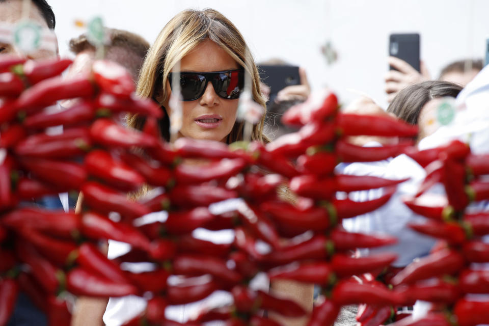 U.S. First Lady Melania Trump looks at Espelette pepper in Espelette, near Biarritz, southwestern France, Sunday Aug. 25, 2019. Leaders of major democracies are meeting to discuss the shaky world economy amid trade disputes, rising tensions with Iran and uncertainty over U.S. President Donald Trump's go-it-alone policies. (Regis Duvignau/Pool via AP)