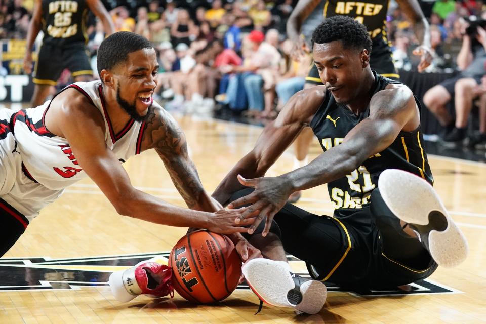 Air Raiders’ Shawndre' Jones, left, battles for the ball against the After Shocks during the TBT Tournament, Saturday, July 24, 2022, in Wichita, Kansas.