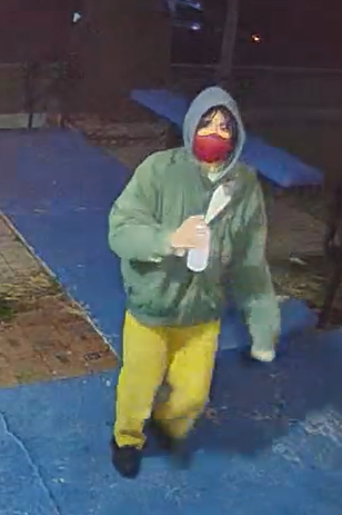 A snapshot of surveillance tape showing a person with a spray paint bottle early Friday morning on the Bradley University campus.  BU police are asking the public for their help in identifying the person shown on this tape, accused of spray-painting anti-Semitic messages on several campus buildings.