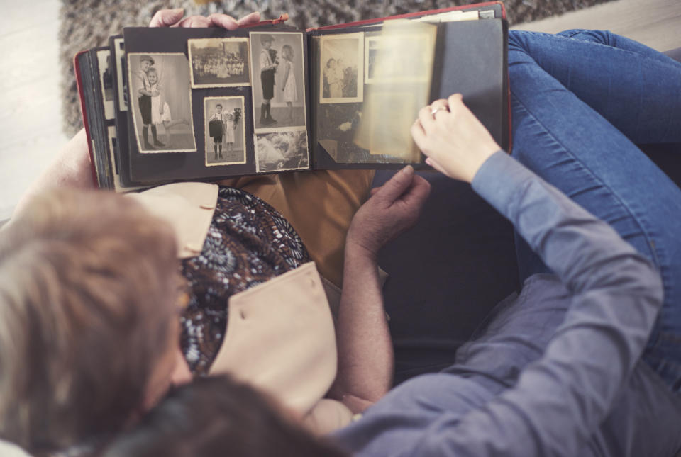 Don't let your old photo albums collect dust—convert those precious memories to digital. (Photo: Getty Images)