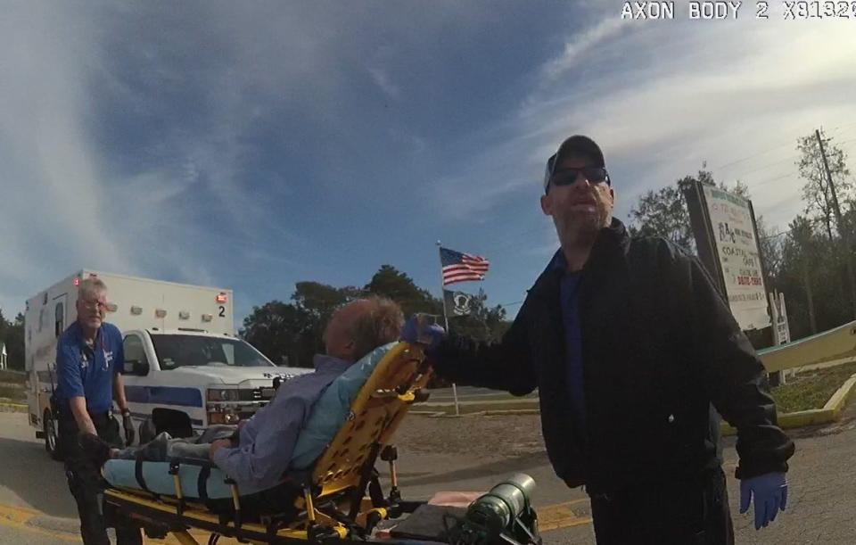 Franklin County emergency medical workers wheel FBI Special Agent Alexis Hatten to an ambulance following a Dec. 20 incident with deputies in Carrabelle.