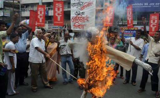 Indian protesters burn an effigy of Indian Prime Minister Manmohan Singh during a nationwide strike in Siliguri on May 31, 2012. Indian newspapers and business leaders savaged the government on Friday, laying the blame for the country's worst growth figures in nine years at the door of Prime Minister Manmohan Singh