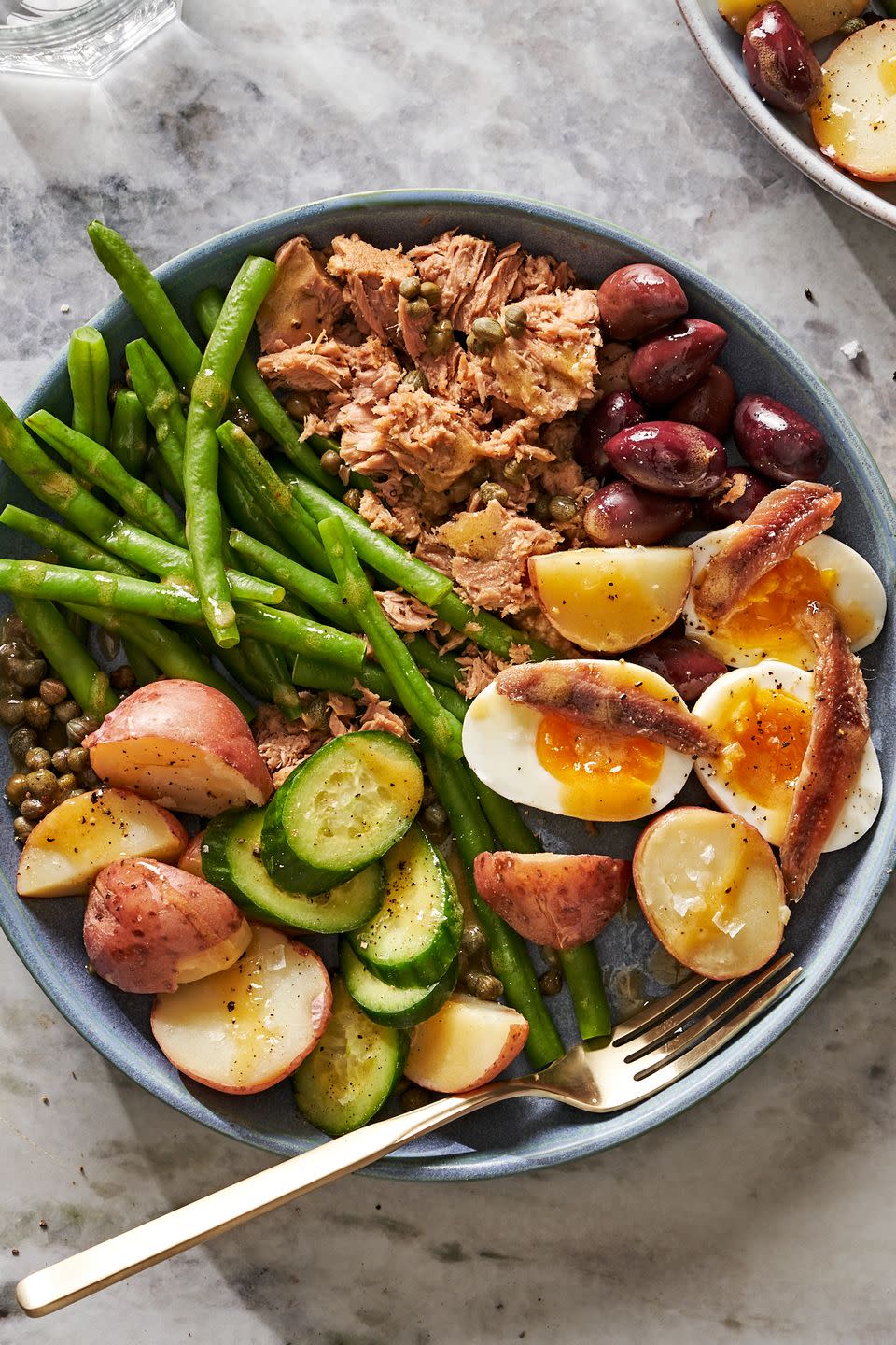 <p>According to food historians, the first Niçoise salad (from Nice, on <a href="https://www.delish.com/cooking/g2095/easy-french-recipes/" rel="nofollow noopener" target="_blank" data-ylk="slk:France’s;elm:context_link;itc:0;sec:content-canvas" class="link ">France’s</a> southeastern coast) contained only tomatoes, olive oil, and anchovies. Over the years, ingredients have been added and subtracted, so feel free to do the same and go with your favorites!</p><p>Get the <strong><a href="https://www.delish.com/cooking/recipe-ideas/a39564289/classic-nicoise-salad-recipe/" rel="nofollow noopener" target="_blank" data-ylk="slk:Niçoise Salad recipe;elm:context_link;itc:0;sec:content-canvas" class="link ">Niçoise Salad recipe</a></strong>.</p>