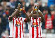 Football Soccer - Sunderland v Manchester United - Barclays Premier League - Stadium of Light - 13/2/16 Sunderland's Lamine Kone and Dame N'Doye applaud the fans at the end of the match Reuters / Phil Noble Livepic