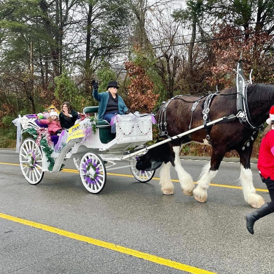 A snapshot from Karns Fair’s Facebook page shows WBIR news personality Heather Waliga, the Grand Marshal for the 2022 Karns Christmas Parade. She is accompanied by her daughter Haley and is presented by Cynthia Conner and Dino of Cinderella Farm and Carriage, a Karns tradition. Dec. 3, 2022.