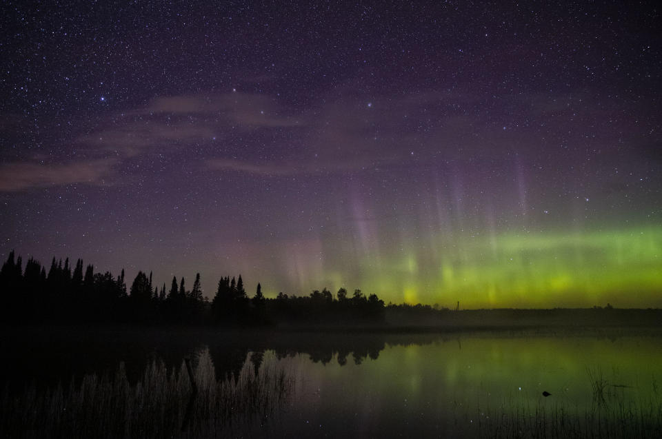The aurora borealis could be seen on the North horizon in the night sky over Wolf Lake in the Cloquet State Forest in Minnesota around midnight on Saturday, Sept. 28, 2019. / Credit: Alex Kormann/Star Tribune via Getty Images