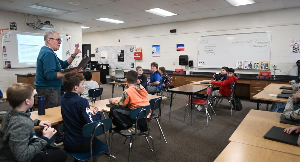 Grand Ledge Hayes Intermediate School robotics teacher Tim Madden talks to students, Wednesday, Nov. 29, 2023, during his robotics enrichment class. There are more than 30 unique enrichment classes students may choose from based on their personal interests.