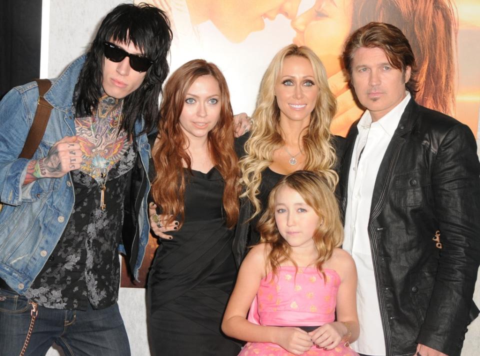 <p>When the "Achy Breaky Heart" singer married Tish, he adopted her daughter <a href="https://www.eonline.com/news/1064757/brandi-cyrus-breaks-silence-on-sister-miley-s-split-from-liam-hemsworth-i-m-here-for-her-obviously?query=brandi%20cyrus" rel="nofollow noopener" target="_blank" data-ylk="slk:Brandi Cyrus;elm:context_link;itc:0;sec:content-canvas" class="link "><strong>Brandi Cyrus</strong></a> (born May 26, 1987) and son <a href="https://www.eonline.com/news/trace_cyrus" rel="nofollow noopener" target="_blank" data-ylk="slk:Trace Cyrus;elm:context_link;itc:0;sec:content-canvas" class="link "><strong>Trace Cyrus</strong></a> (Feb. 24, 1989), whose biological father is their mom's ex-husband <strong>Baxter Helson</strong>.</p>