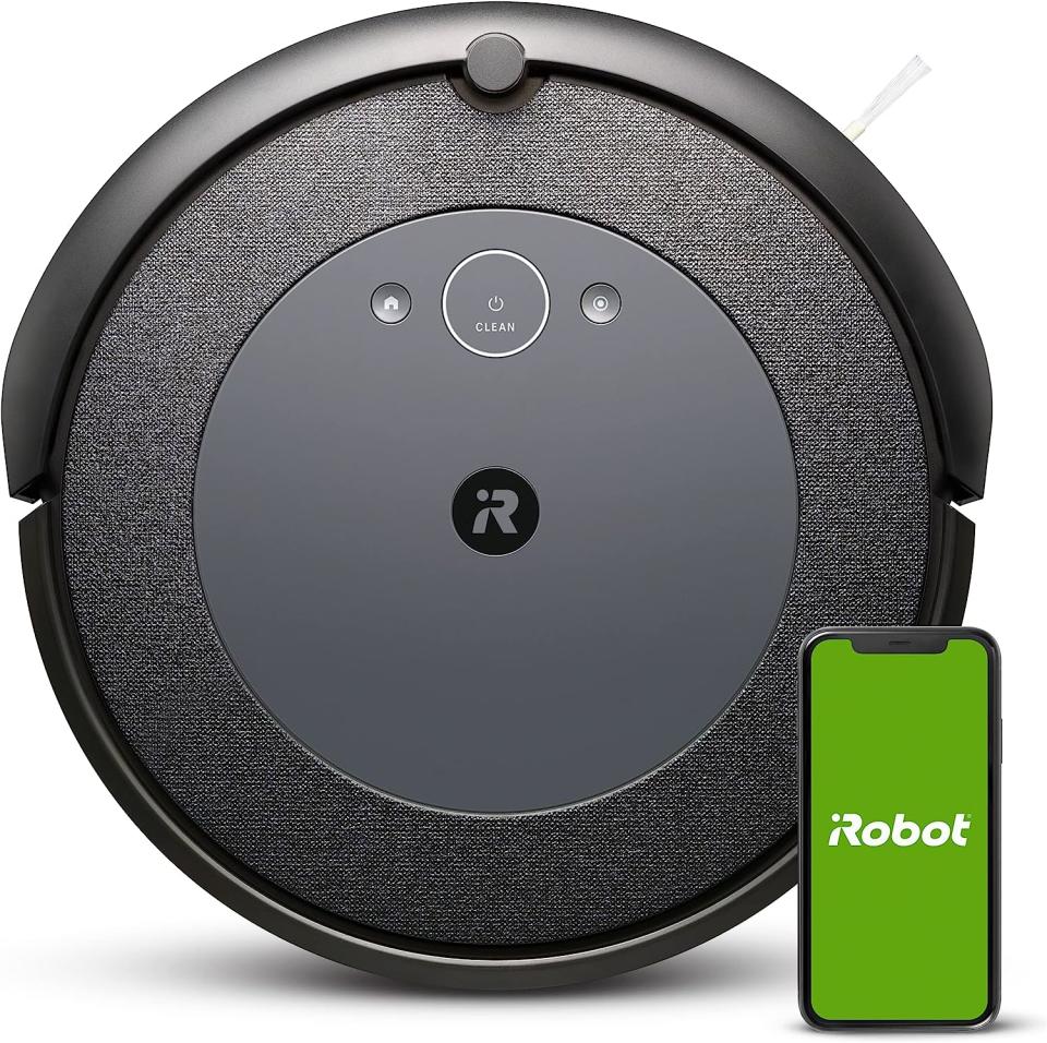 the Amazon irobot roomba vacuum and a phone with the app