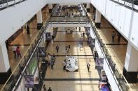 People walk at Mall of the Emirates in Dubai, United Arab Emirates, Thursday, April 15, 2021. The Middle East's largest operator of malls, Majid Al Futtaim, expects revenue and earnings to climb back to pre-pandemic levels by the end of next year and is moving full steam ahead with plans to develop its biggest mall ever. (AP Photo/Kamran Jebreili)