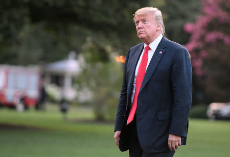 U.S. President Donald Trump walks from Marine One as he returns to the White House in Washington, U.S., July 26, 2018. REUTERS/Mary F. Calvert